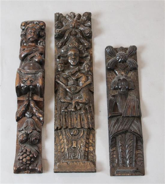 Two similar 17th century carved oak figural corbels and one other, all approx. 21in.